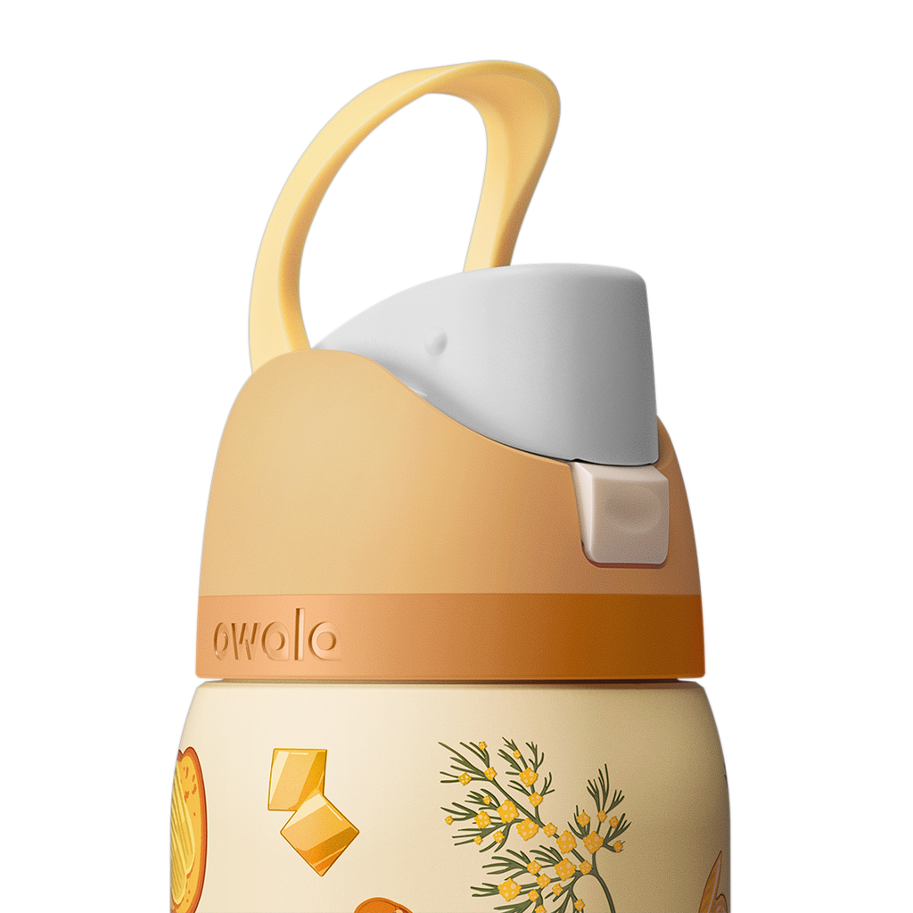 Owala FreeSip 32oz in Brunch Bunch, close-up of the peach flip cap with cream carry loop raised, push-button release visible